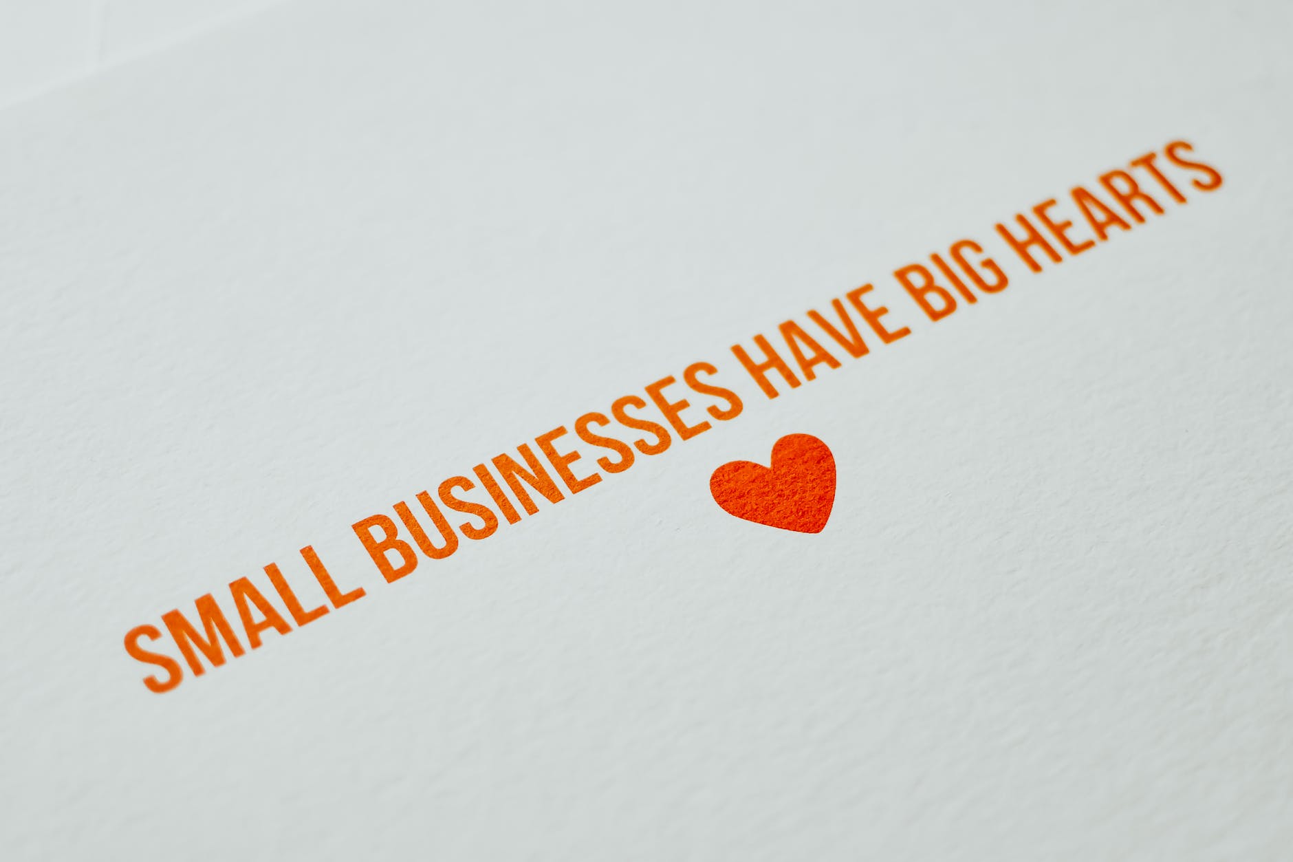 small businesses have big hearts text on a white surface