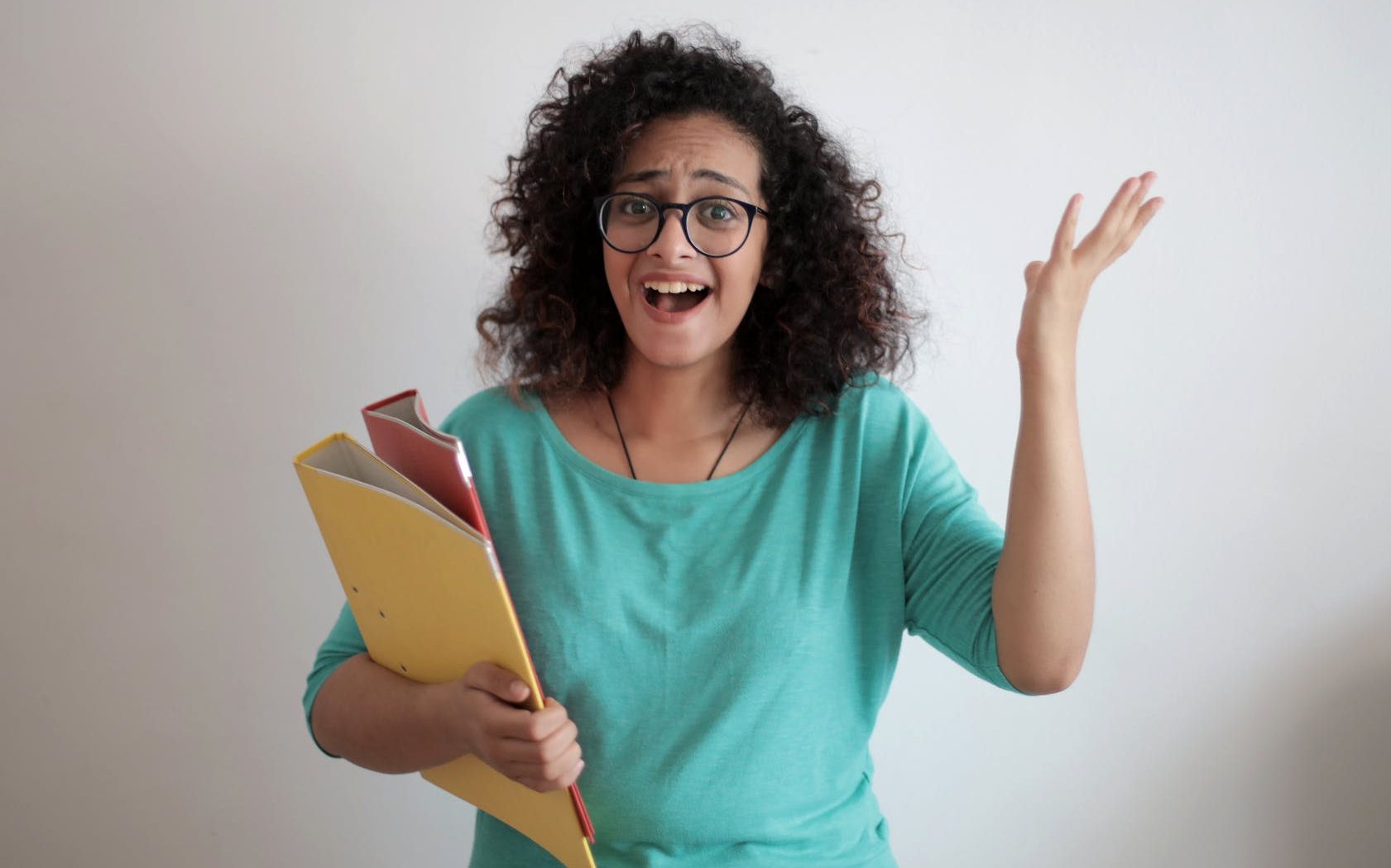 adult displeased businesswoman with papers in light modern office
